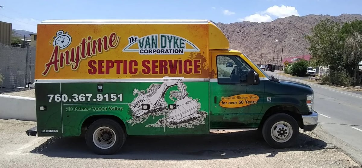 Van Dyke Septic Service truck, yellow and green with company logo and phone number on side